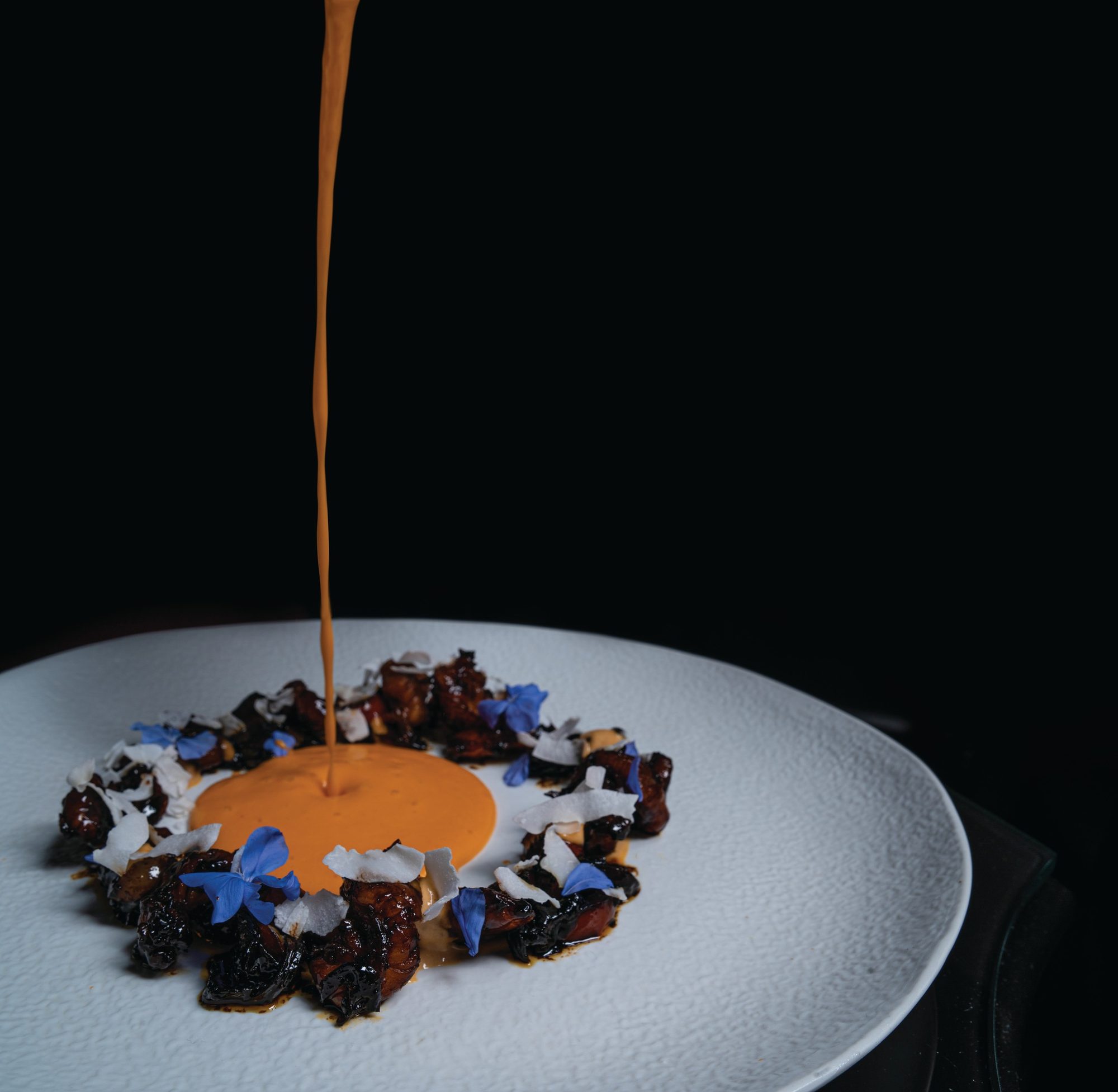 Fine dining sauce pour over plated dish
