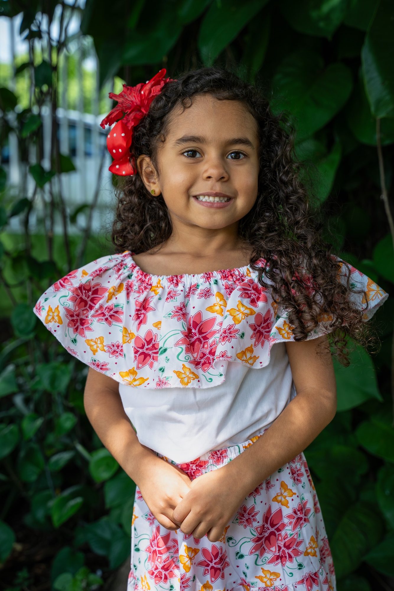 Child portrait with red flower