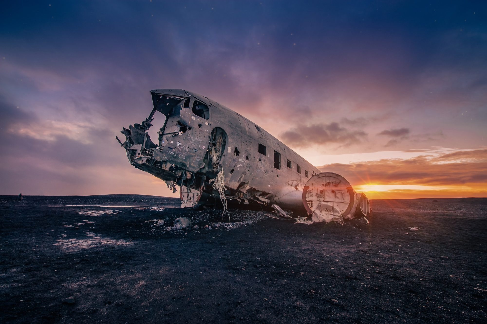 Sólheimasandur plane wreck — final retouched image with sunset grade